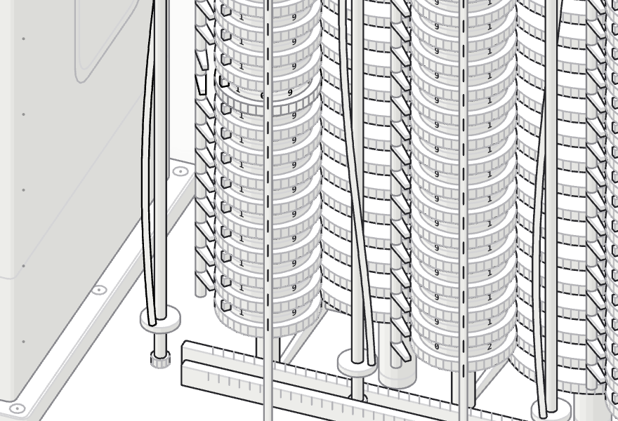 Close-up of two columns of figure wheels with the carry levers between them, one column standing at a row of nines with the index bar reading each digit.
