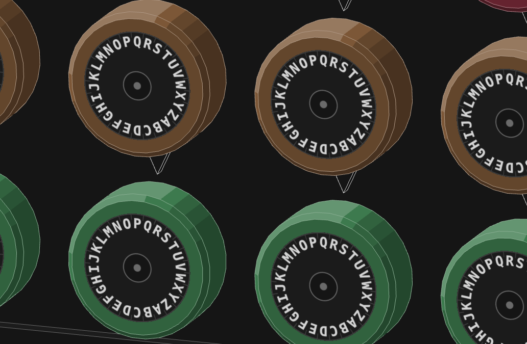 The 3D machine's drums close up: a row of brown drums over a row of green ones, each face ringed with the letters A to Z and read against a pointer above it.